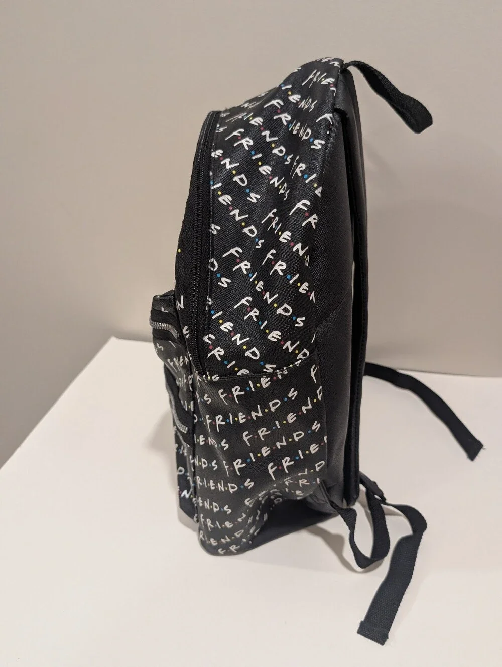 Friends Backpack all over print. need small repair see zoomed in photo